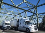 Trucks move across the Interstate 5 Bridge, which frequently sees traffic in excess of its design capacity.