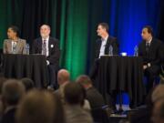 Rukaiyah Adams, chief investment officer at Myer Memorial Trust, from left, David Nierenberg, president of Nierenberg Investment Management Company, Scott Keeney, CEO of nLIGHT, and Jason DeSena Trennert, Chairman and CEO of Strategas Securities, listen to a moderator's question during the 2019 Clark County Economic Forecast at the Hilton Vancouver Washington on Thursday morning, Jan. 17, 2019.