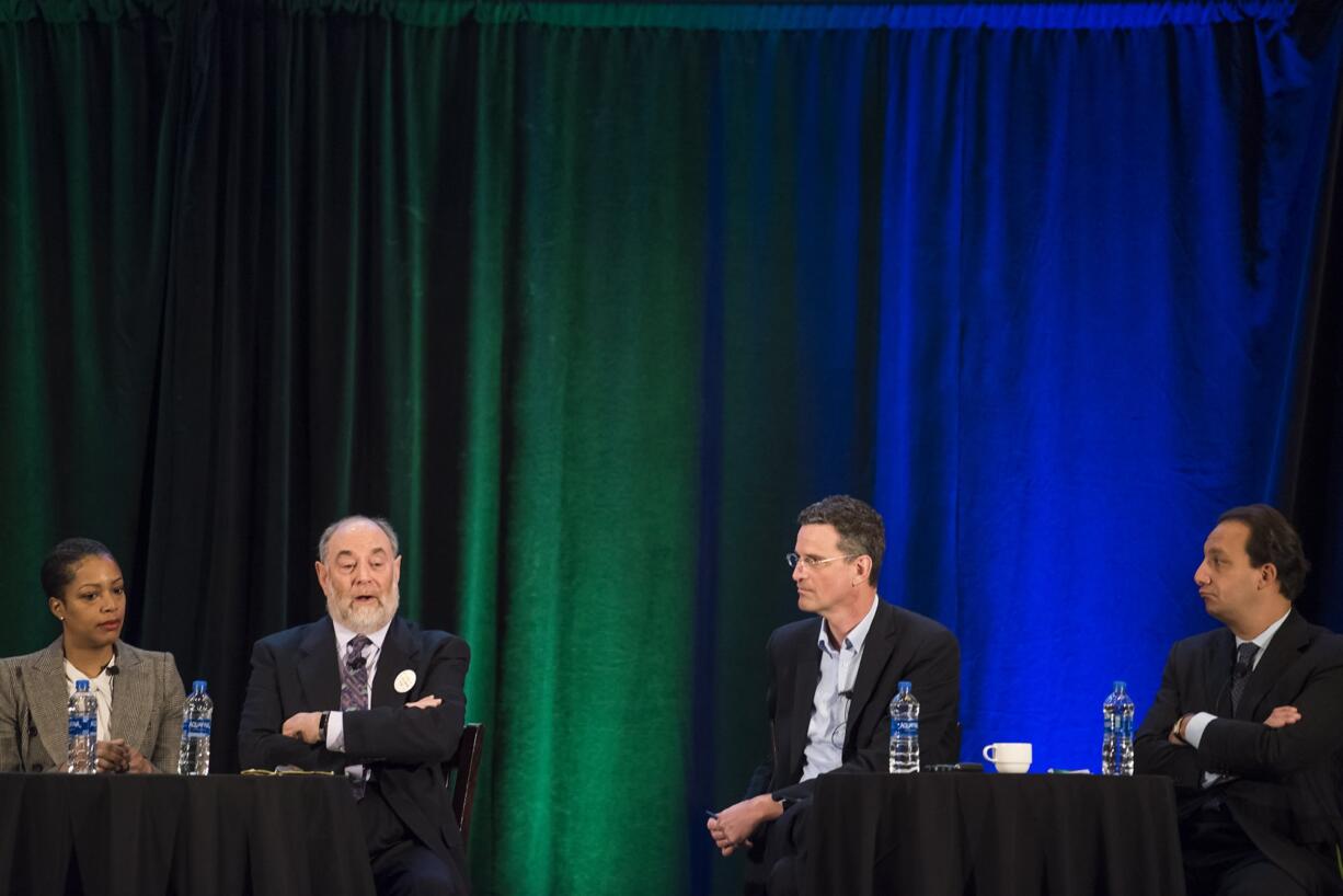 Rukaiya Adams, cheif investment officer at Myer Memorial Trust, from left, David Nierenberg, president of Nierenberg Investment Managment Company, Scott Keeney, CEO of nLIGHT, and Jason DeSena Trennert, Chairman and CEO of Strategas Securities, answer a moderator's question at the Hilton Vancouver Washington on Thursday morning, Jan. 17, 2019.