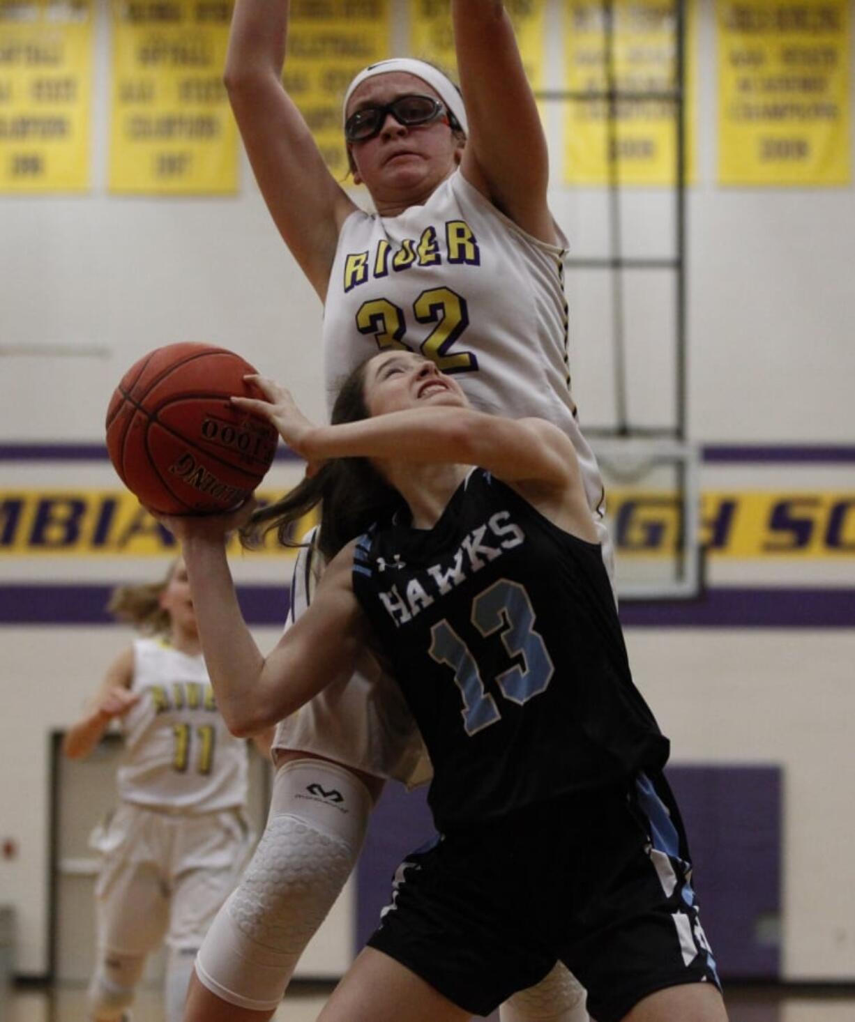 Hockinson’s Addie Chappelle (13), shoots against Columbia River’s Ellie Christian.