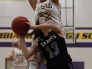 Hockinson’s Addie Chappelle (13), shoots against Columbia River’s Ellie Christian.