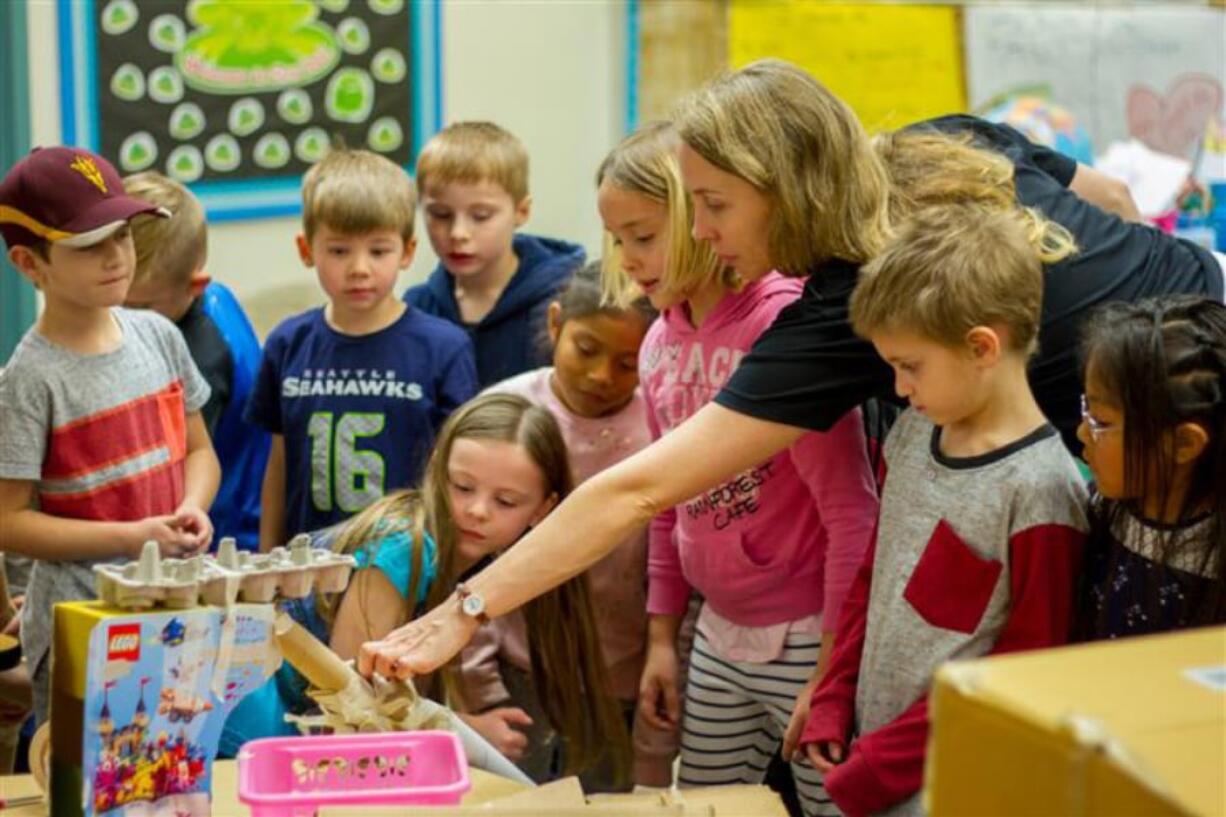 Woodland: Students learn gravity, slope, force and engineering design by building Rube Goldberg machines in Lyndal Mezes’ class for the Explorience program, a 70-minute weekly experiential learning program.