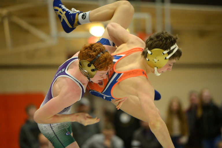 Heritage's Israel Gonzalez throws Ridgefield's Bracen Nash at the Clark County Wrestling Championship at Battle Ground High School on Saturday, January 12, 2019.