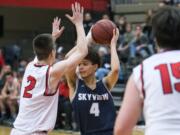 Skyview's Squeeky Johnson (4) looks to pass during Friday night's game against Camas at Camas High School on Jan. 11, 2019.