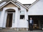 Pacific Lifestyle Homes founder Kevin Wann walks through one of the Pacific Lifestyle Homes under construction at the Seven Wells Estates community in Ridgefield.