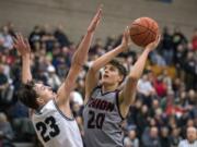 Skyview’s Kyle Gruhler (23) jumps to block Union’s Josh Reznick (20) during Tuesday night’s game at Skyview.