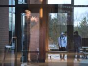 Clark College President Bob Knight speaks Thursday while students walk past during the annual State of the College address. Knight pledged to continue supporting Clark College’s diverse student body, and touted some of the gains the college has made toward promoting equity.