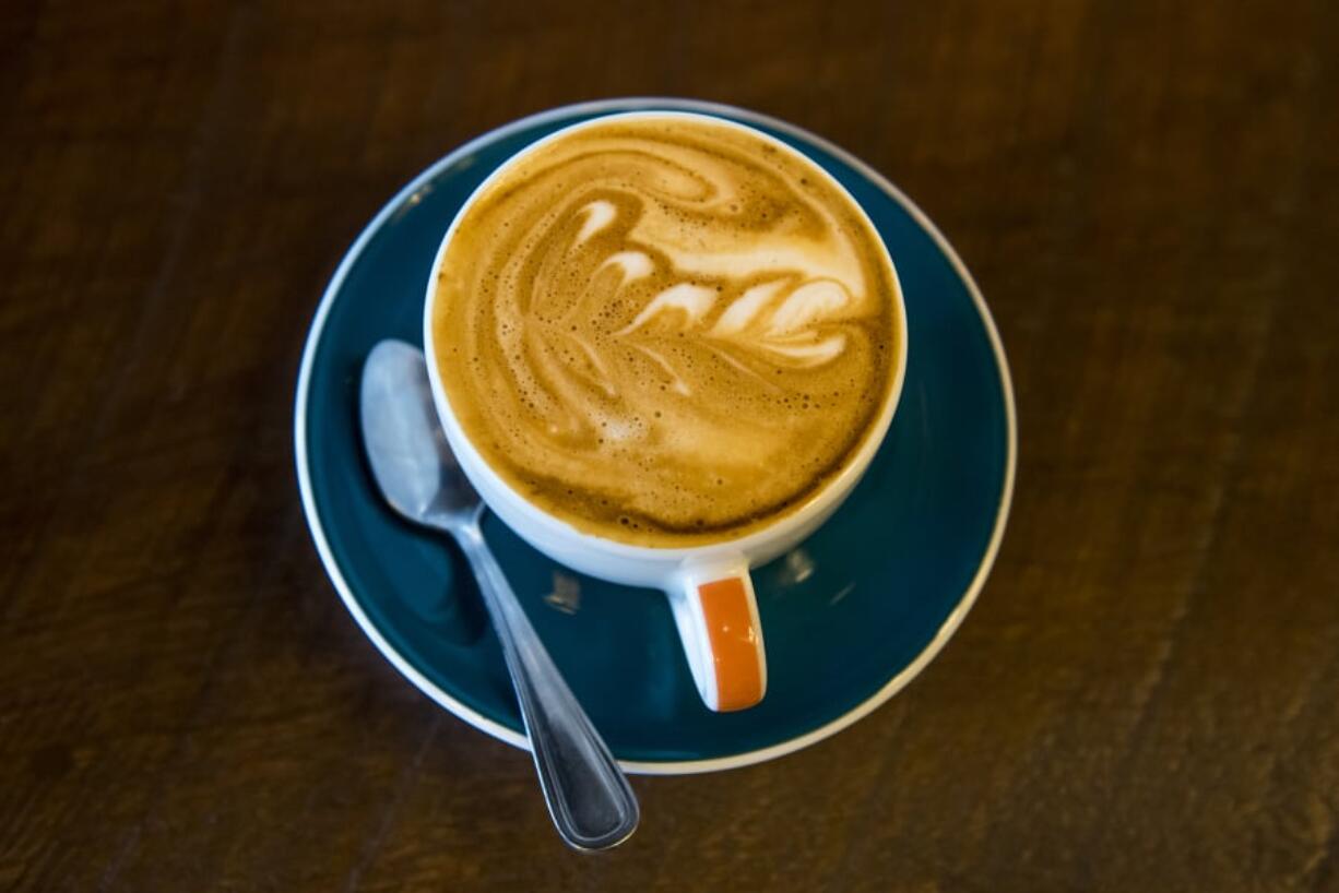 A freshly brewed cappuccino sits on the counter at Compass Coffee in downtown Vancouver.