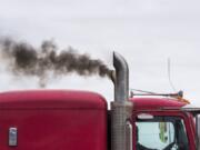 Exhaust pours out of a semi-truck as it leaves the Port of Vancouver on Friday. Areas near the port score poorly in a study that ranks health risks caused by environmental quality.