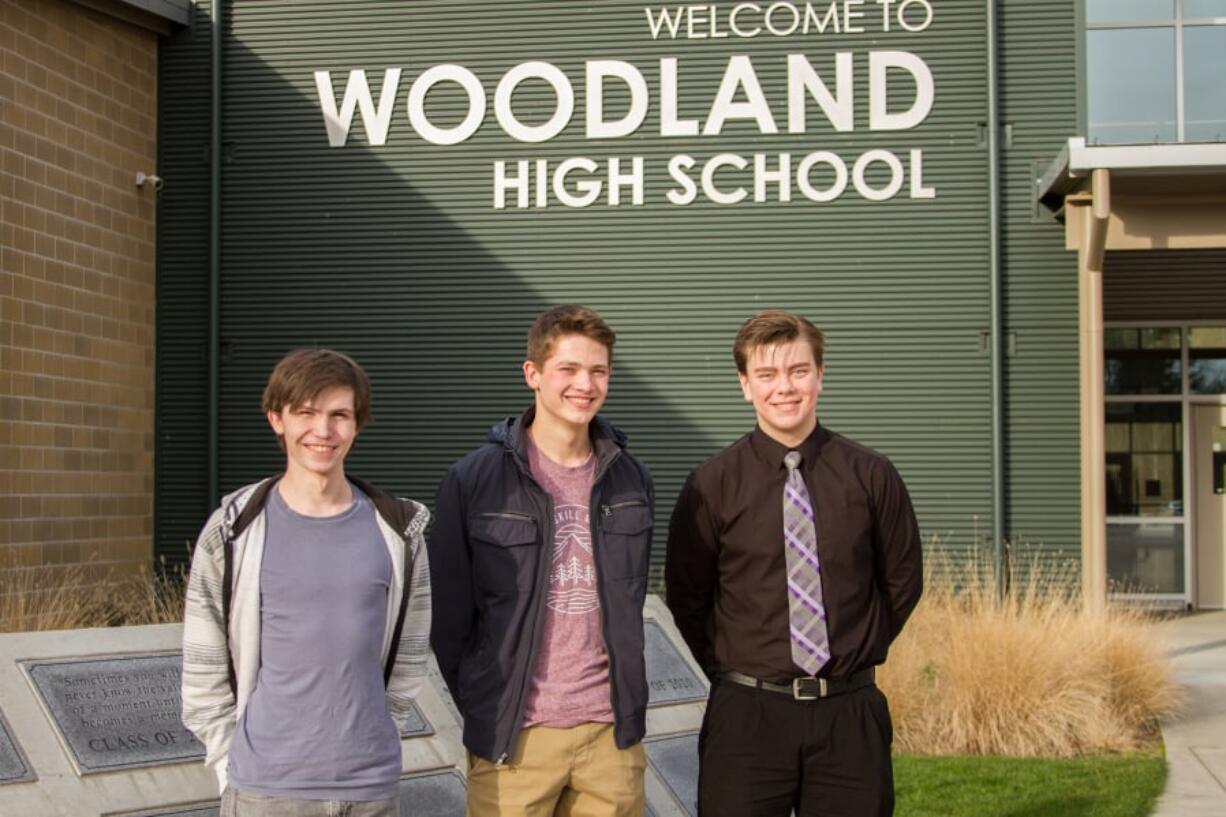 Orion Hollar, from left, Michael Gabalis and Evan Ailinger are Woodland High School seniors who each earned a perfect 800 score on the math section of the SAT. They credited family and careful preparation.