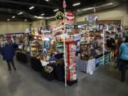 Shoppers browse an antique road show Sunday at the Clark County Event Center at the Fairgrounds.