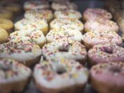 Glazed and sprinkled round doughnuts at Angel’s Donuts & Ice Cream.