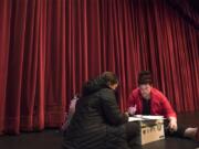 Katie Hinton, a secretary at Felida Elementary School, left, and Katherine Eterno-Tuominen, a media clerk with Vancouver Public Schools, tally ballots following a strike vote during a Vancouver Association of Educational Support Professionals meeting on Tuesday night. About 93 percent of the 500 in attendance voted to strike effective Friday if a deal is not reached with the district.