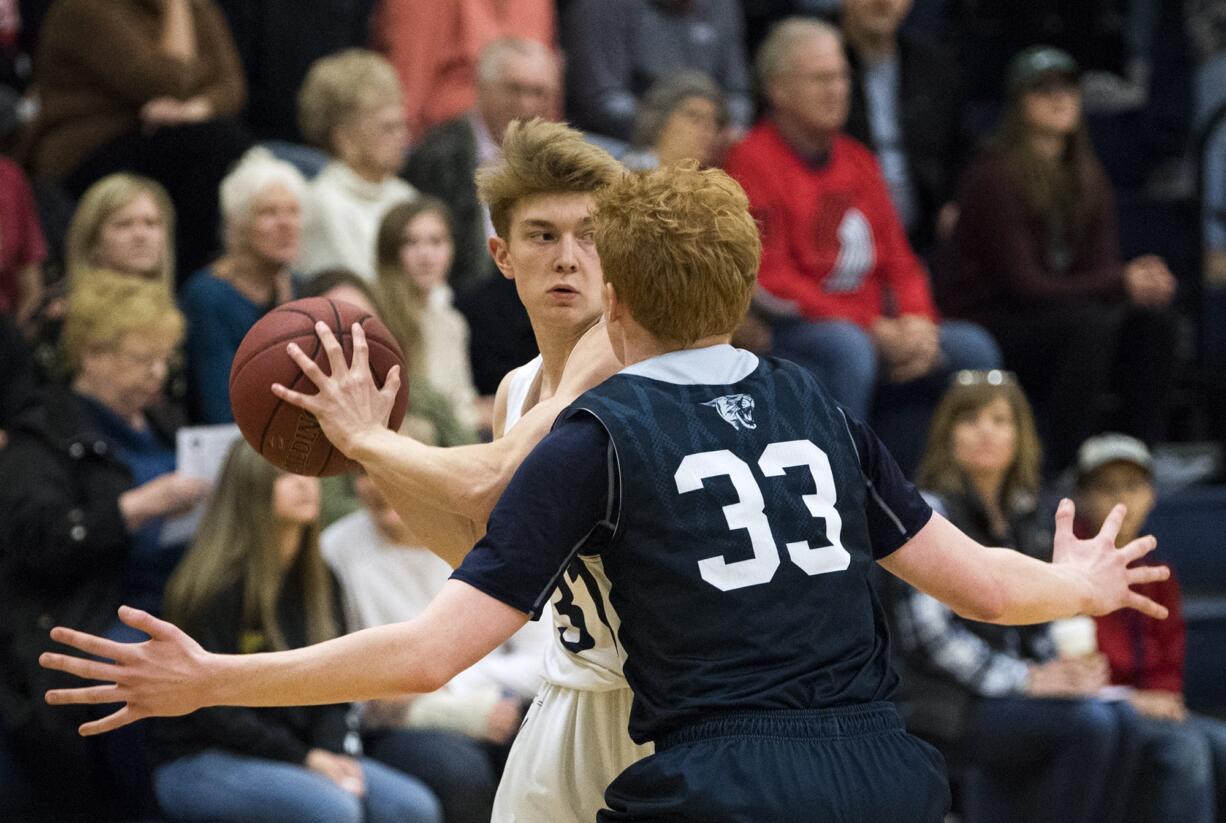 King's Way's Brady Metz (31) looks to pass as Seton's Andrew Olson (33) defends him during Friday night's game at King's Way High School in Vancouver on Jan. 25, 2019. King's Way won 75-66.