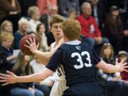 King's Way's Brady Metz (31) looks to pass as Seton's Andrew Olson (33) defends him during Friday night's game at King's Way High School in Vancouver on Jan. 25, 2019. King's Way won 75-66.