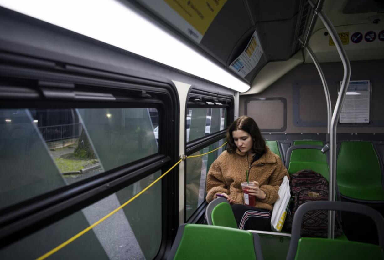 Helene Furst of Vancouver rides on The Vine in Vancouver. Furst said she is excited about the rapid transit line because it will speed up her daily commutes to school and work.