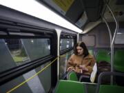 Helene Furst of Vancouver rides on The Vine in Vancouver. Furst said she is excited about the rapid transit line because it will speed up her daily commutes to school and work.