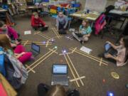 Fourth-graders at Silver Star Elementary School react as they test out their Sphero robots during science class. These Sphero robots are funded by local levy dollars, and it appears voters have approved Evergreen Public Schools levy requests to continue this and other programs.