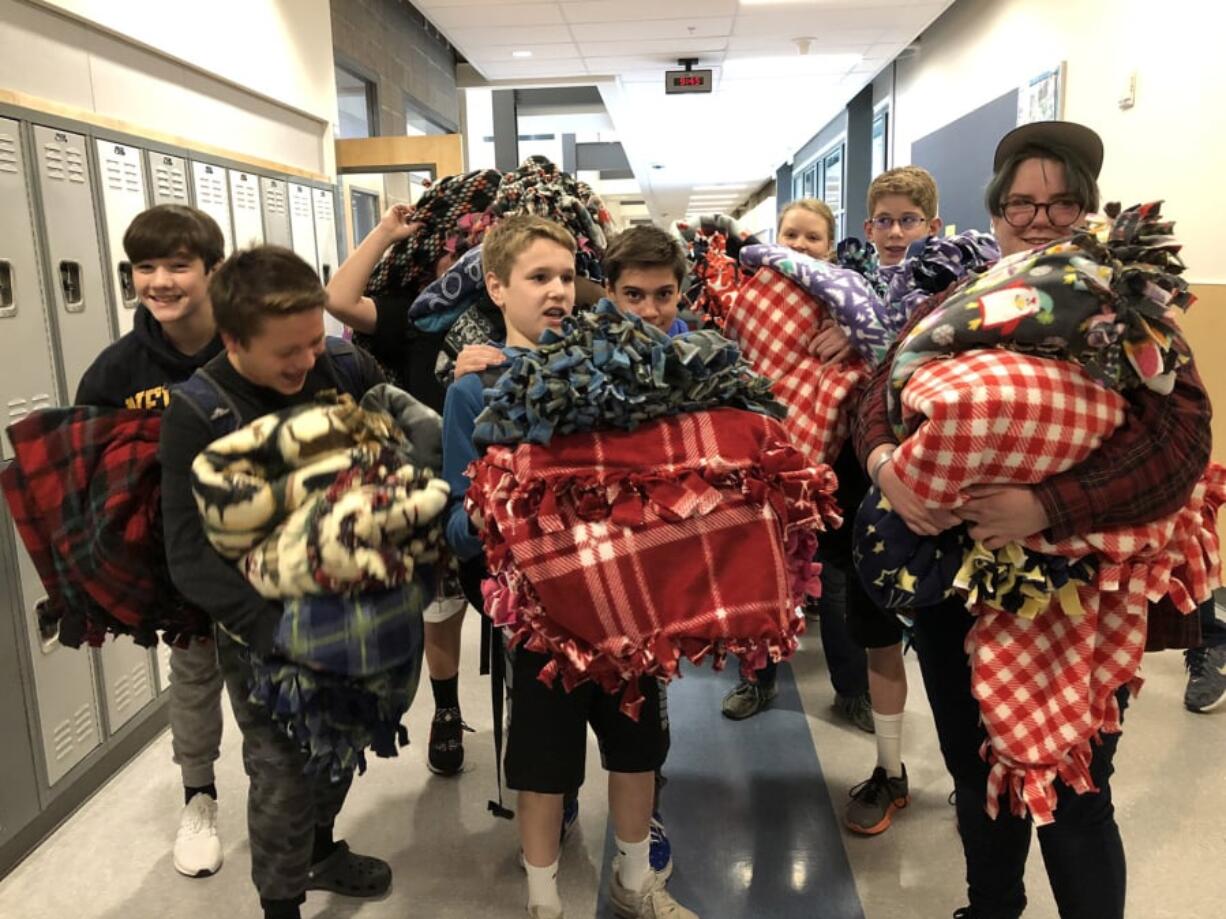 Brush Prairie: Hockinson Middle School students hosted their first Community Service Day in December, and some students turned fleecy fabrics into 37 blankets, which were donated to Vancouver’s Winter Hospitality Overflow shelter.