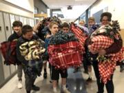 Brush Prairie: Hockinson Middle School students hosted their first Community Service Day in December, and some students turned fleecy fabrics into 37 blankets, which were donated to Vancouver’s Winter Hospitality Overflow shelter.