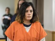 Emily Javier, 31, who’s accused of attacking her boyfriend with a samurai sword, enters the courtroom on Jan. 23 to plead guilty to attempted first-degree domestic violence murder in Clark County Superior Court.