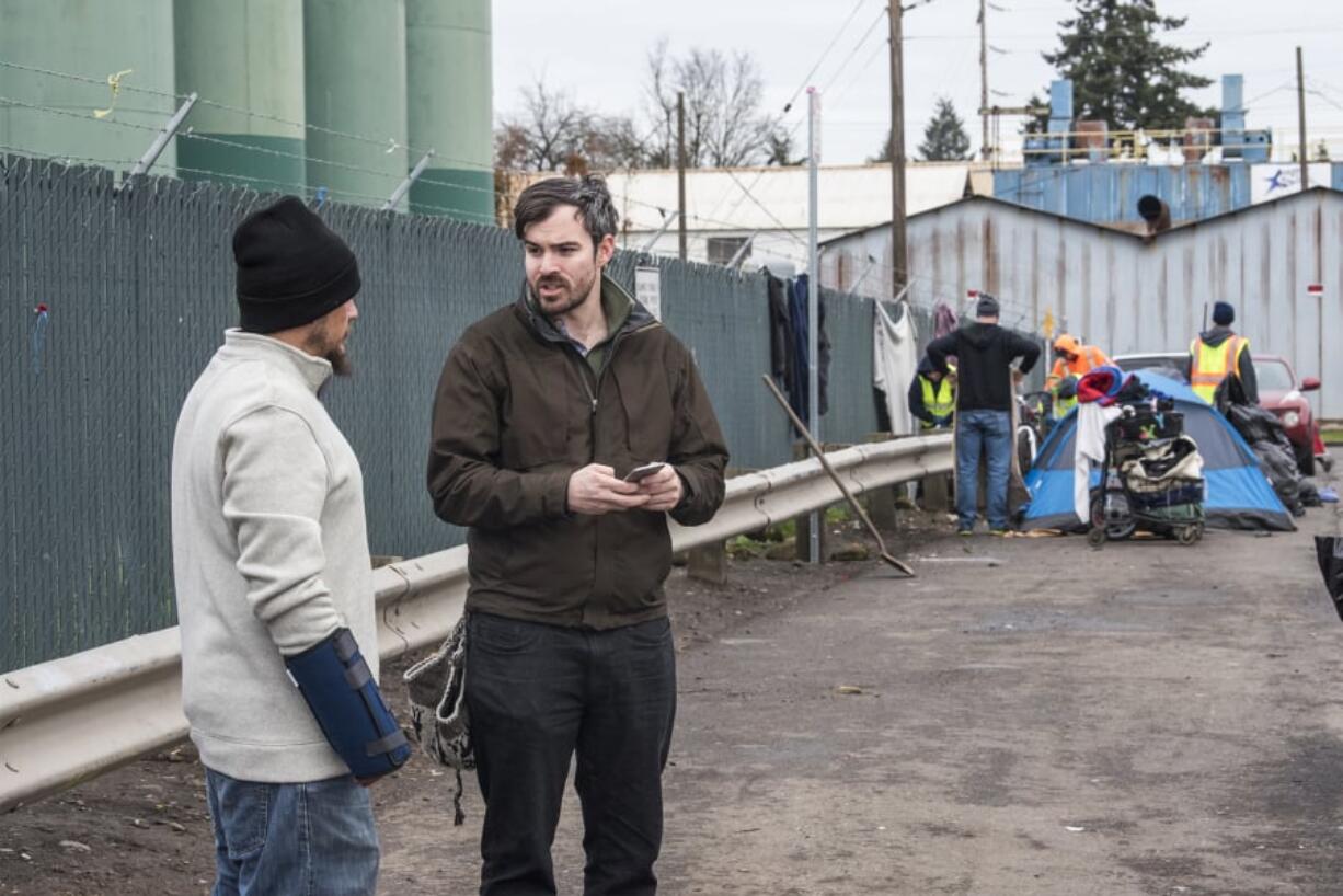 William Silva, left, speaks to Blake Hauser, an outreach case manager with Share, in January for the annual Point in Time count. By midmorning Hauser said he’d seen many familiar faces as he helped conduct a census of Clark County’s homeless population.