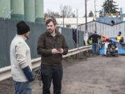 William Silva, left, speaks to Blake Hauser, an outreach case manager with Share, in January for the annual Point in Time count. By midmorning Hauser said he’d seen many familiar faces as he helped conduct a census of Clark County’s homeless population.