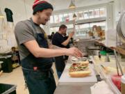 Jason Spaulding and Joey Chmiko assemble sandwiches at Nonavo Sandwich.