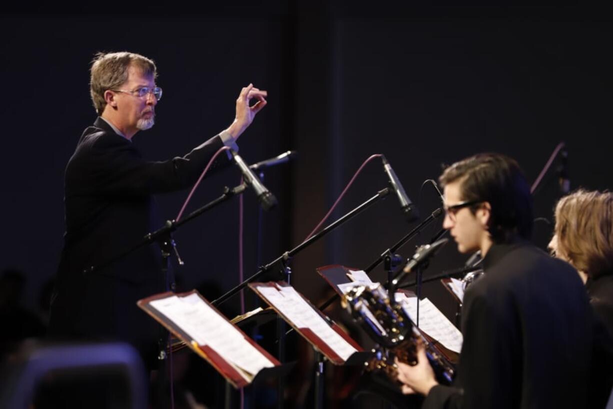 Doug Harris directs the Clark College jazz band at the Clark College 57th annual Jazz Festival Saturday. The weekend festival was Harris’ first after longtime band director Richard Inouye retired last spring.