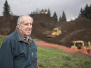 Nathan Howard/The Columbian Julian Levi, an immigrant from what is now Zimbabwe and longtime Clark County resident, was curious about extensive excavation at the corner of Northeast Hazel Dell Avenue and Northeast Anderson Street.