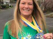 Central Vancouver: Diane Sprenger, 60, received this medal for running a half-marathon at Disney World in Florida. She has more than 30 medals for running races.