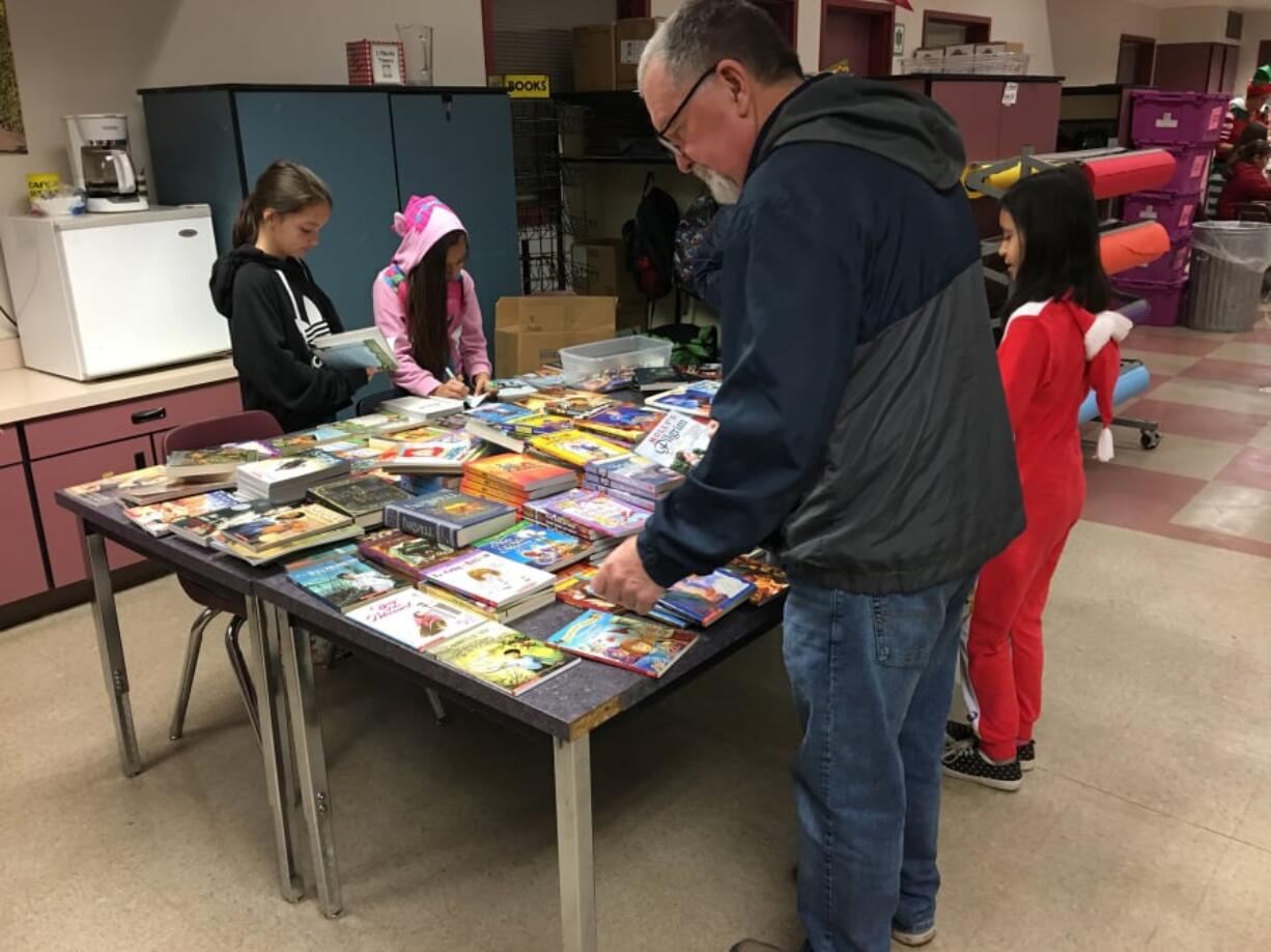 Bagley Downs: The Vancouver Sunrise Rotary Club adopted Roosevelt Elementary School, and donated a bunch of books to the school so each student could select a book to take home and keep.