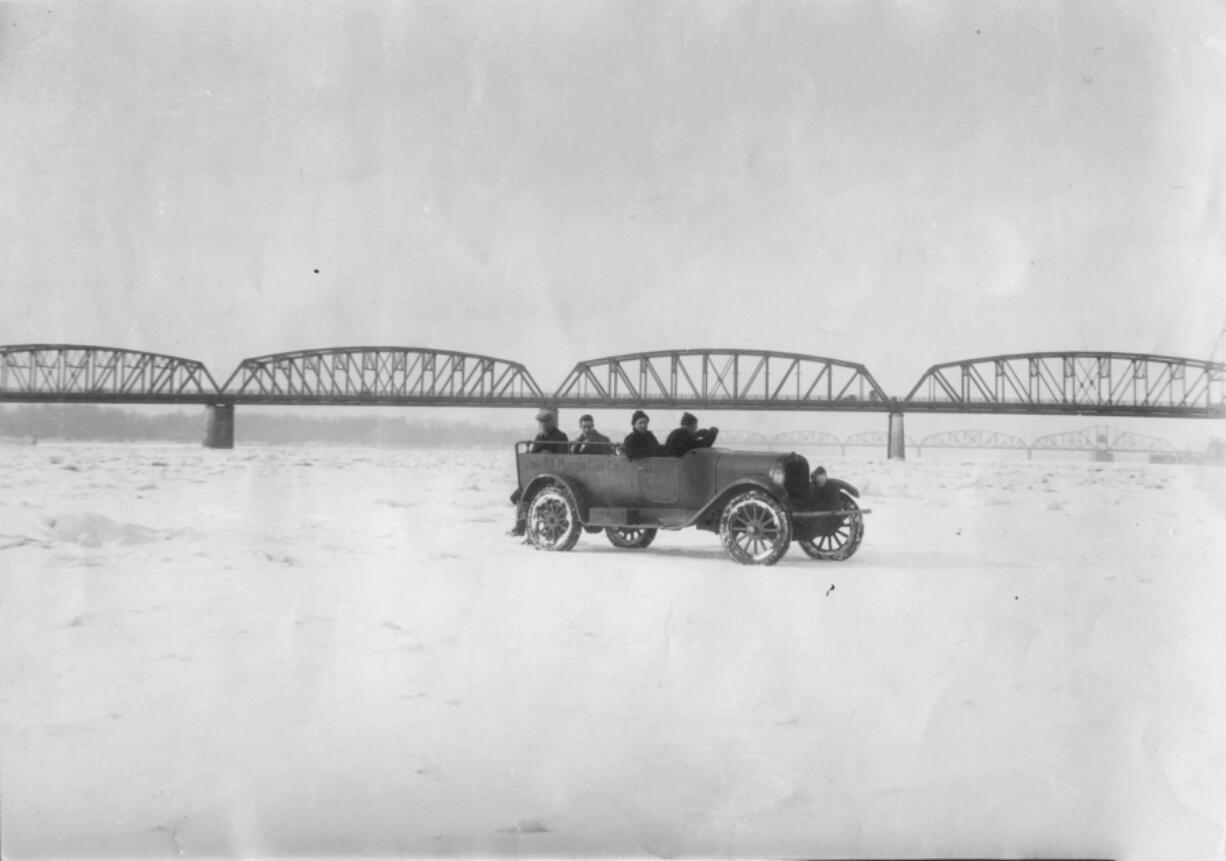 A car drives over the Columbia River after it froze in 1930. The river froze over a handful of times in the early 20th century, though milder winter temperatures and the construction of dams have prevented ice from forming on the waterway in the last 88 years.