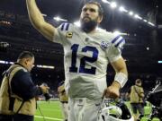 Indianapolis Colts quarterback Andrew Luck (12) runs off of the field after the team's win over the Houston Texans in an NFL wild card playoff football game, Saturday, Jan. 5, 2019, in Houston.