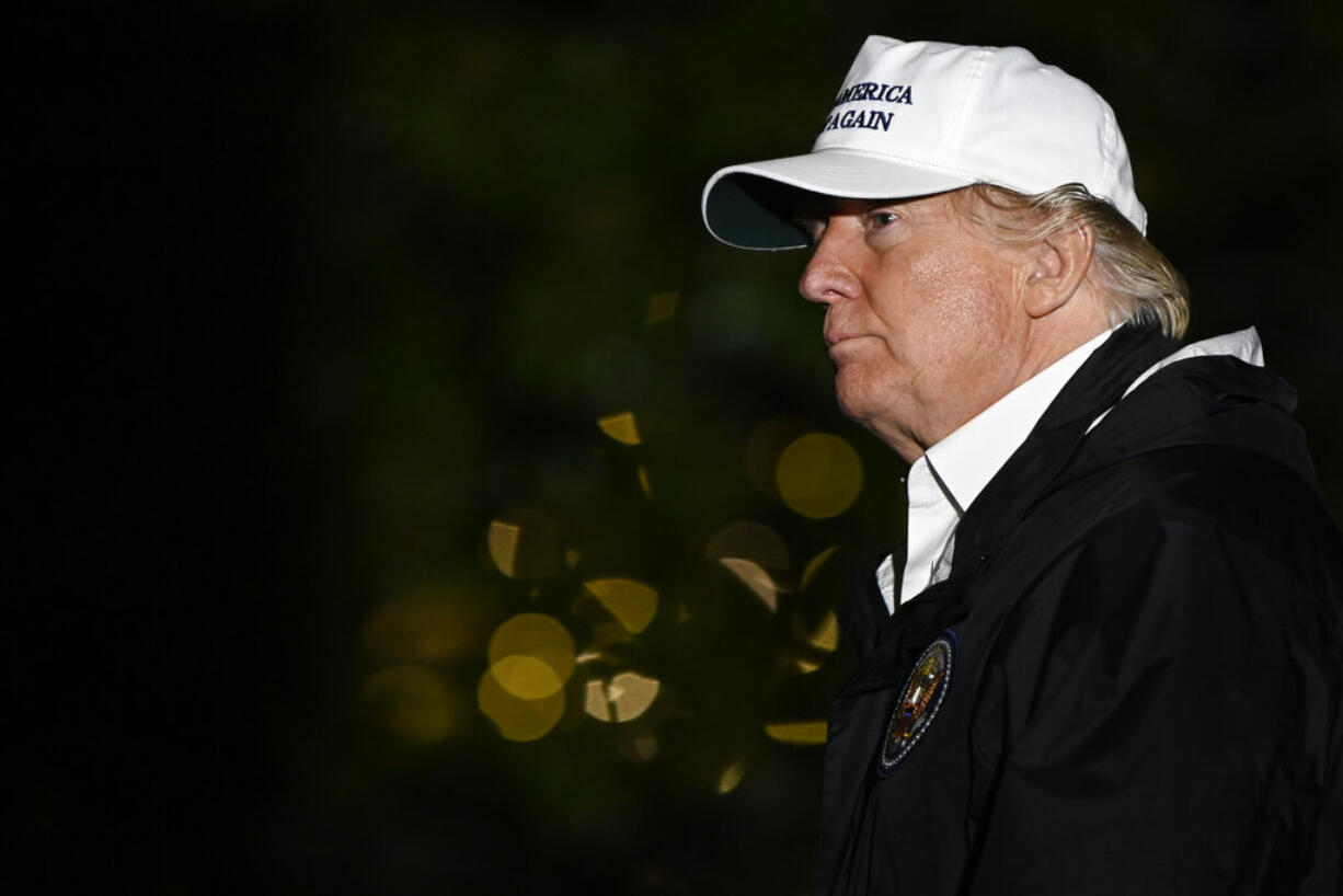 President Donald Trump walks on the South Lawn of the White House in Washington, Thursday, Jan. 10, 2019, after returning from a trip to the southern border.