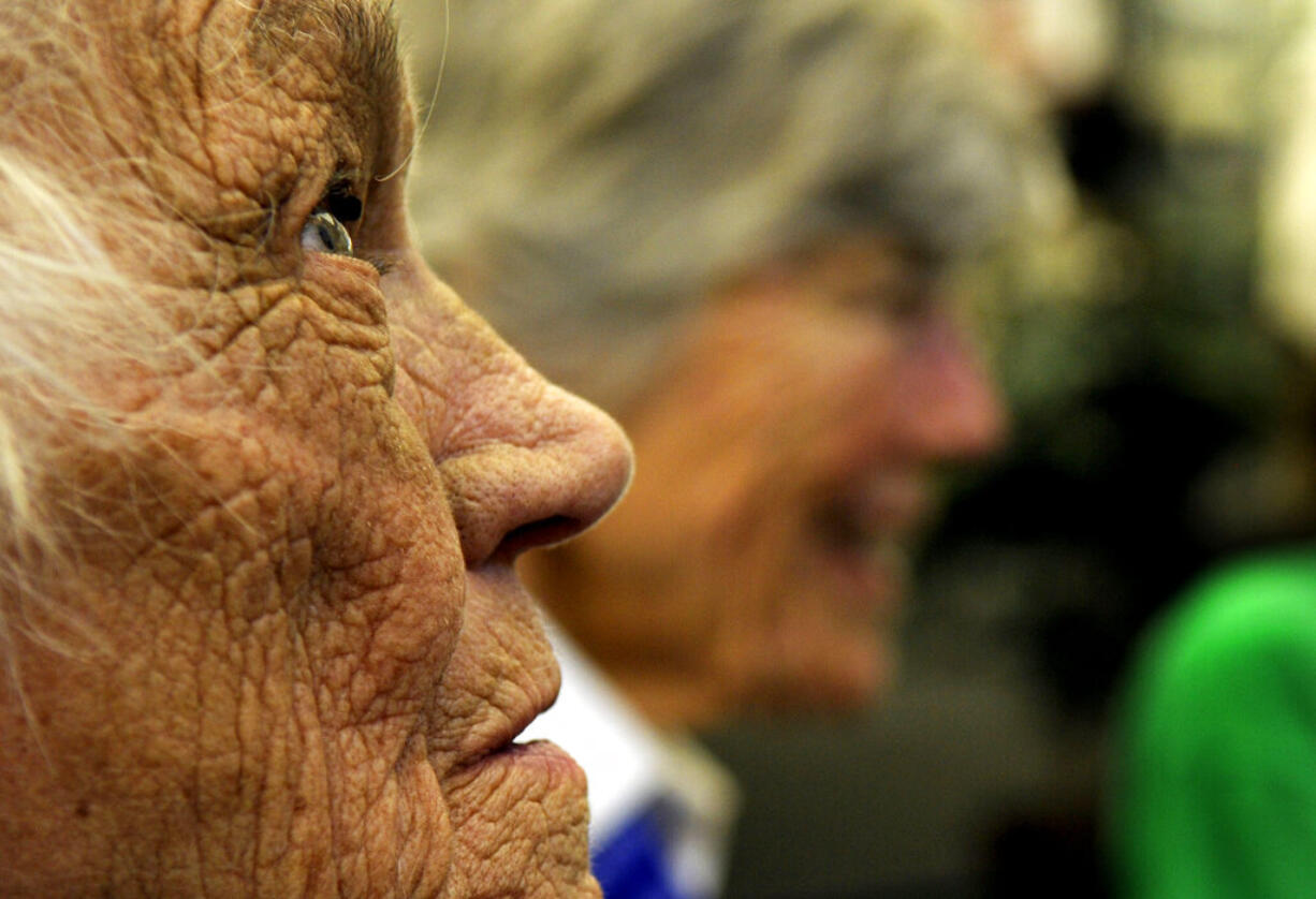 FILE - In this July 15, 2010 file photo, Millicent Peterson Young of Colorado Springs, Colo., a member of the Women Airforce Service Pilots, or WASPs, during World War II, looks on during an event at the Bird Aviation Museum and Invention Center in Sagle, Idaho. Young died Saturday, Jan. 12, 2019, at the age of 96. Young and other WASPs flew bombers and other warplanes in the United States during the war to free up male pilots for combat service overseas.