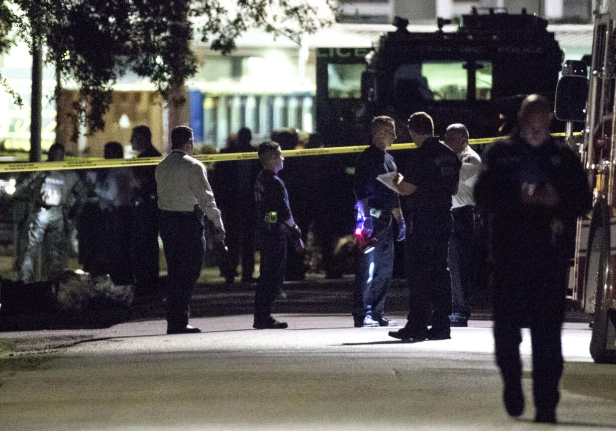 Police investigate the scene where several Houston Police officers were shot in Houston on Monday, Jan. 28, 2019. At least five Houston officers were injured in a shooting Monday in an incident involving a suspect and taken to a hospital, police said.