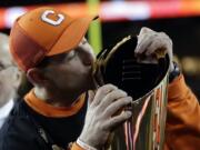 Clemson head coach Dabo Swinney kisses the championship trophy after the NCAA college football playoff championship game against Alabama, Monday, Jan. 7, 2019, in Santa Clara, Calif. Clemson beat Alabama 44-16. (AP Photo/David J.