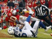 Kansas City Chiefs wide receiver Tyreek Hill (10) scores a touchdown past Indianapolis Colts safety Clayton Geathers (26) during the first half of an NFL divisional football playoff game in Kansas City, Mo., Saturday, Jan. 12, 2019.