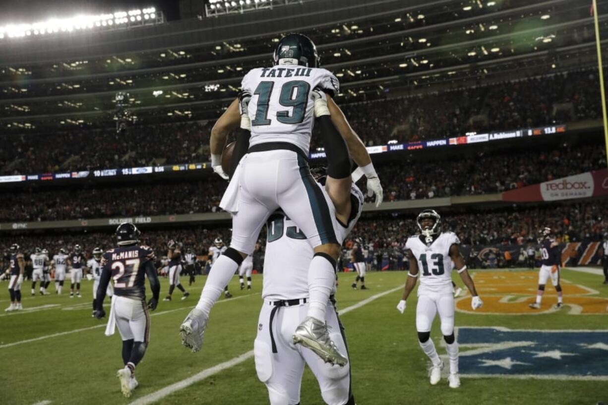 Philadelphia Eagles wide receiver Golden Tate (19) celebrates his touchdown reception with offensive tackle Lane Johnson (65) during the second half of an NFL wild-card playoff football game against the Chicago Bears Sunday, Jan. 6, 2019, in Chicago. (AP Photo/Nam Y.