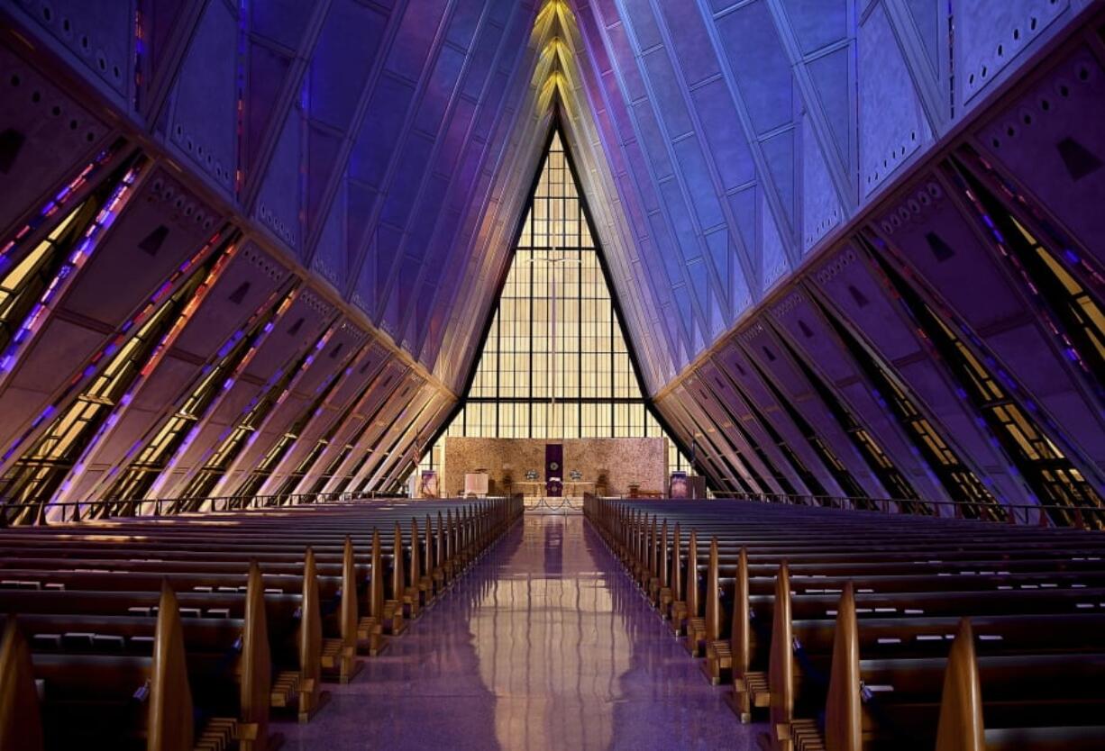 In this April 12, 2017, photo, light shines through the stained glass at the Cadet Chapel at the U.S. Air Force Academy outside Colorado Springs, Colo. The landmark Cadet Chapel is suffering from leaks and corrosion, so the school has drawn up the most ambitious restoration project in the building’s 55-year history.