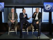 NHL Commissioner Gary Bettman, center, joins Deputy Commissioner Bill Daly, left, and Tod Leiweke, right, president and CEO of the Seattle Hockey Partners group, Wednesday, Jan. 9, 2019, during a news conference in Seattle. Bettman said the NHL has promised Seattle it will host the hockey All-Star Game within its first seven seasons. (AP Photo/Ted S.