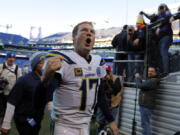 Los Angeles Chargers quarterback Philip Rivers celebates as he walks off the field after an NFL wild card playoff football game against the Baltimore Ravens, Sunday, Jan. 6, 2019, in Baltimore. Los Angeles won 23-17.