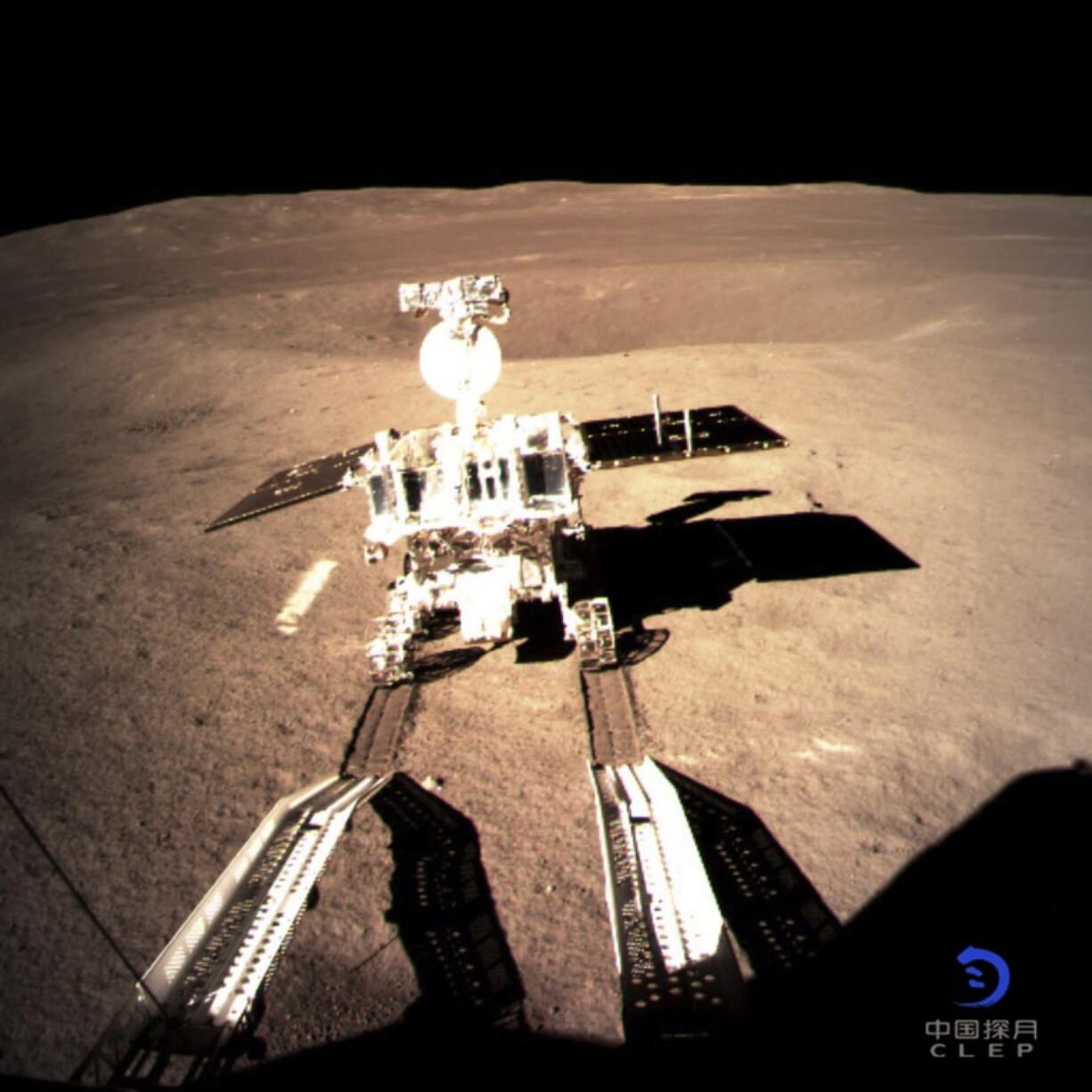 In this photo provided on Thursday, Jan. 3, 2019, by China National Space Administration via Xinhua News Agency, Yutu-2, China’s lunar rover, leaves wheel marks after leaving the lander that touched down on the surface of the far side of the moon. A Chinese spacecraft on Thursday, Jan. 3, made the first-ever landing on the far side of the moon, state media said. The lunar explorer Chang’e 4 touched down at 10:26 a.m., China Central Television said in a brief announcement at the top of its noon news broadcast.