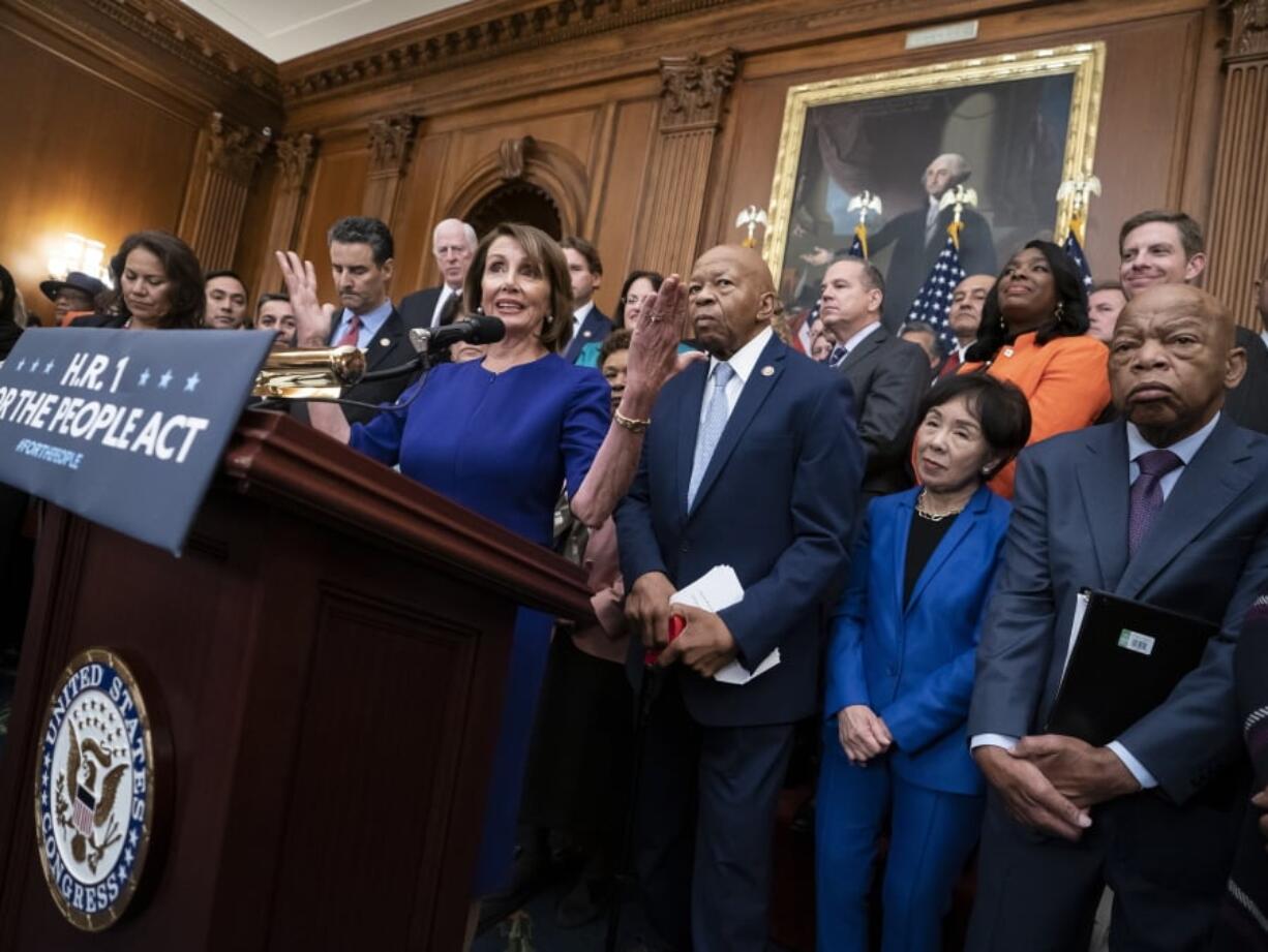 Speaker of the House Nancy Pelosi of Calif., and House Democrats, now in the majority, unveil a comprehensive elections and ethics reform package that targets what they call a “culture of corruption in Washington” and aims to reduce the role of money in politics, at the Capitol in Washington, Friday, Jan. 4, 2019. She is joined from left by Rep. Veronica Escobar, D-Texas, Rep. John Sarbanes, D-Md., Rep. Elijah Cummings, D-Md., chairman of the Committee on Oversight and Government Reform, Rep. Doris Matsui, D-Calif., and Rep. John Lewis, D-Ga. (AP Photo/J.