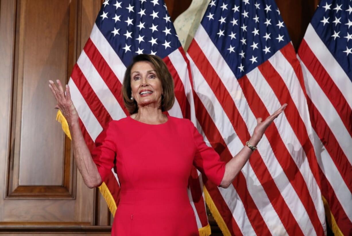 In this Jan. 3, 2019, photo, House Speaker Nancy Pelosi of Calif., gestures before a ceremonial swearing-in on Capitol Hill in Washington, during the opening session of the 116th Congress. House Democrats are unveiling a comprehensive elections and ethics reform package that takes aim at what they call “the culture of corruption in Washington” and reduces the role of money in politics.