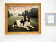 “Millie on the South Lawn” by Christine Merrill, alongside a letter from former first lady Barbara Bush, on display Jan. 9 at the American Kennel Club Museum of the Dog.