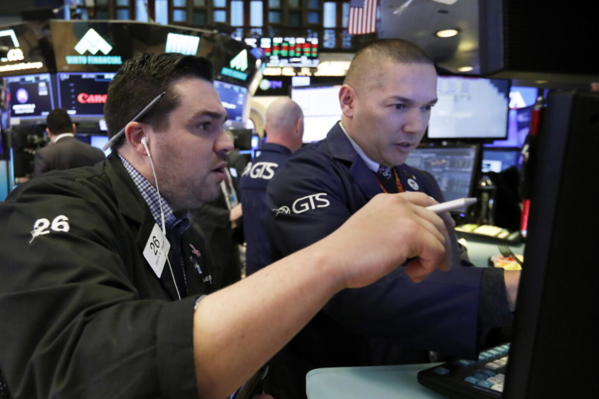 nullFILE- In this Jan. 11, 2019, file photo, trader Joseph Lawler, left, and specialist Mark Otto work on the floor of the New York Stock Exchange. The U.S. stock market opens at 9:30 a.m. EST on Thursday, Jan. 17.