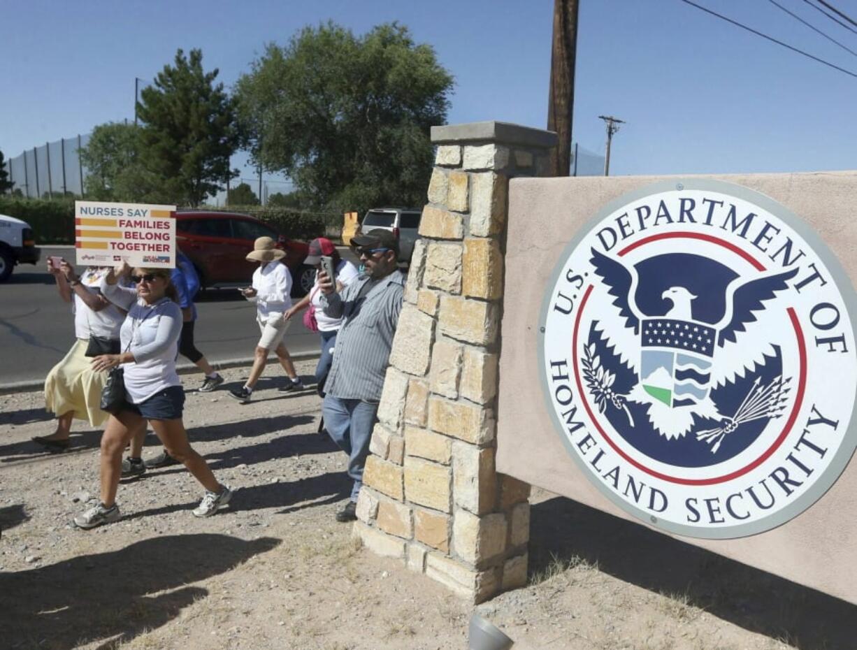 This June 2018 photo shows protesters walking along Montana Avenue outside the El Paso Processing Center, in El Paso, Texas. Federal immigration officials are force feeding some of the immigrants who have been on hunger strike for nearly a month inside the Texas detention facility, The Associated Press has learned.