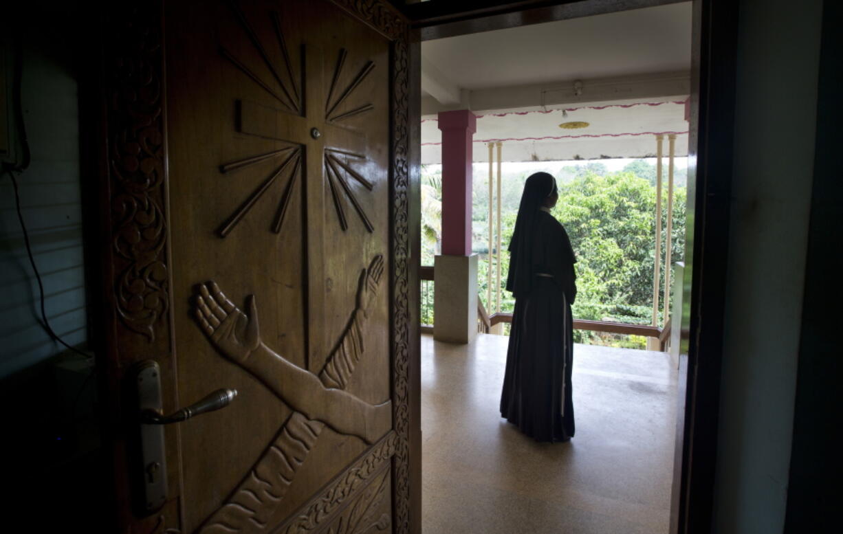 A Catholic nun stands at the foyer of the St. Francis Mission Home in Kuravilangad in the southern Indian state of Kerala. For decades, nuns in India have quietly endured sexual pressure from Catholic priests, an AP investigation has revealed.